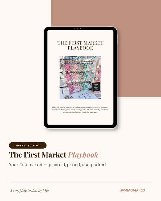 A digital mockup of a tablet displaying a book cover titled "The First Market Playbook" on a clean beige and mauve background. Text below reads "Market Toolkit" and "The First Market Playbook: Your first market — planned, priced, and packed.